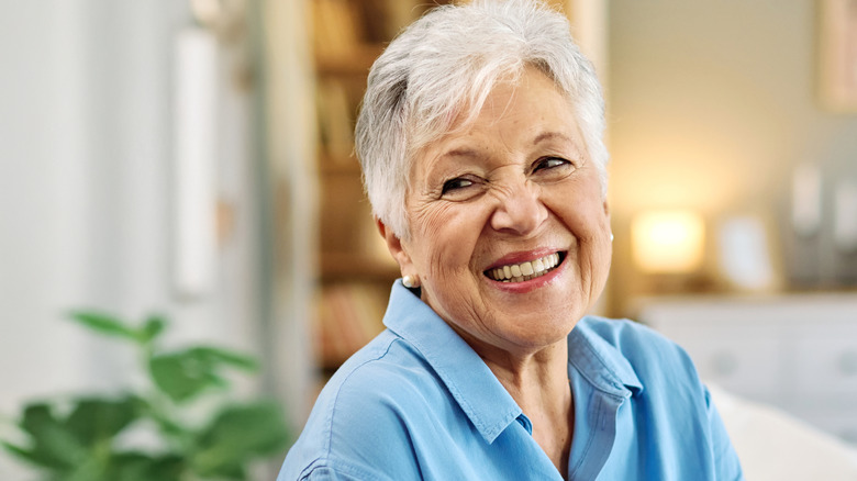 elderly woman smiling in home