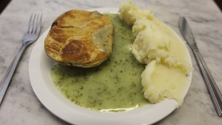 A plate of pie, mash, and liquor, served at M. Manze's in London