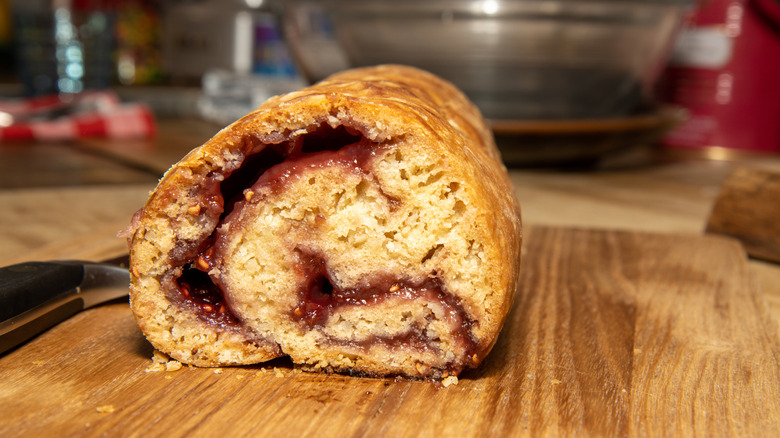 Jam roly-poly, sliced to show the jam and cake-like interior