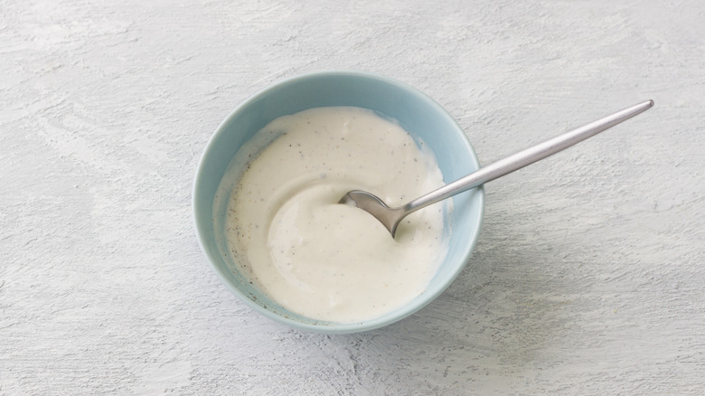 A bowl of creamy salad dressing