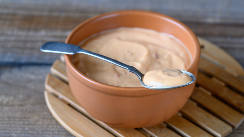 A bowl of creamy salad dressing