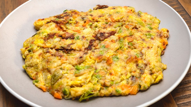 A plate with a fried bubble and squeak patty