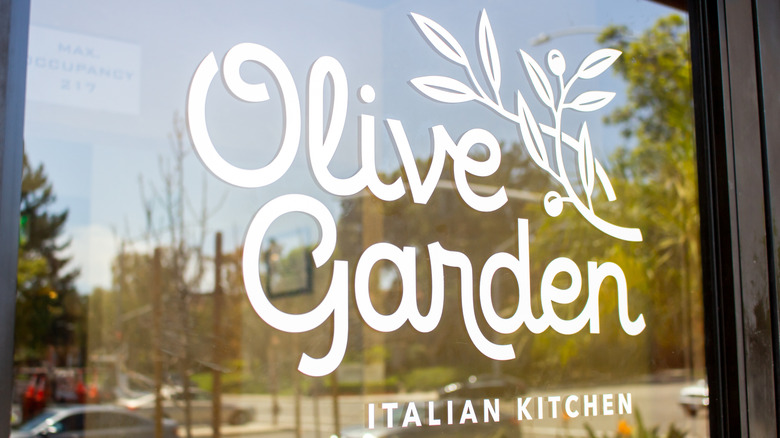 Olive garden logo reflected in glass