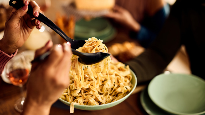 Person serving pasta