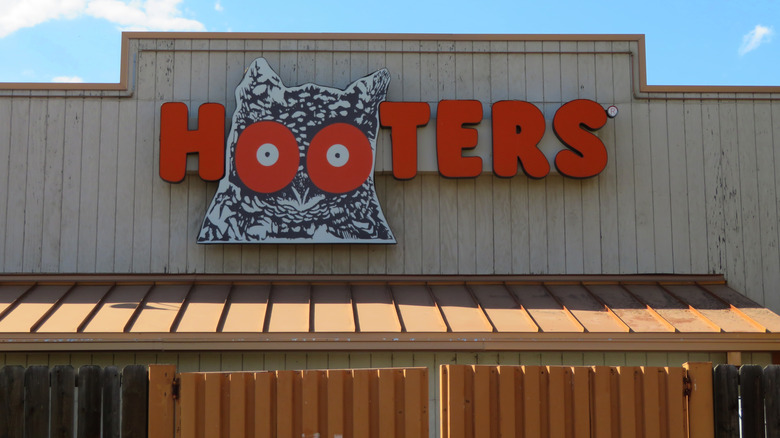 Hooters restaurant sign on a storefront