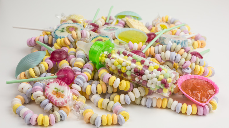 A wide array of colorful candies on white background