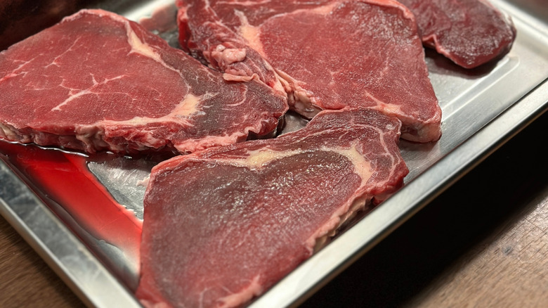 Thawed meat purge in tray