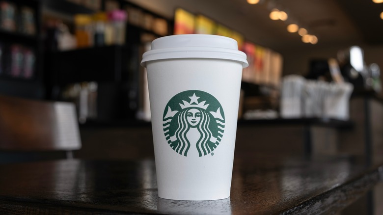 Starbucks cup sitting on table