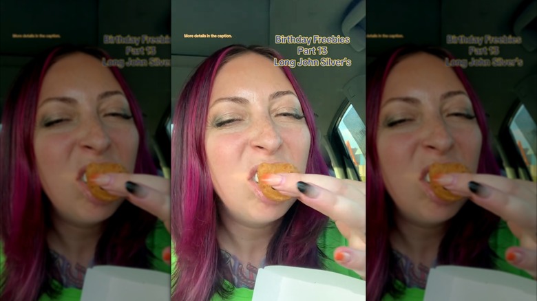 A woman with pink hair bites into a hushpuppy from Long John Silver's, with text on the screen that says "Birthday Freebies, Part 13, Long John Silver's".