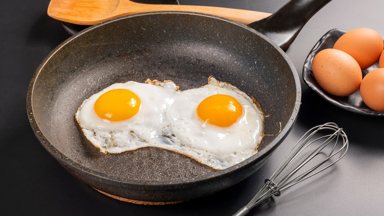 Two fried eggs in a pan