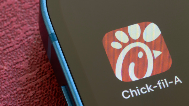 a close up of a phone screen showing the Chick-fil-A app icon.