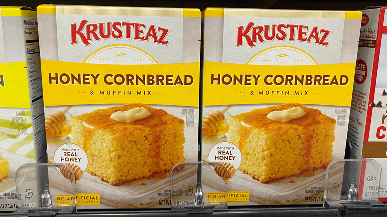 Two boxes of Krusteaz Honey Cornbread & Muffin Mix on a grocery store shelf