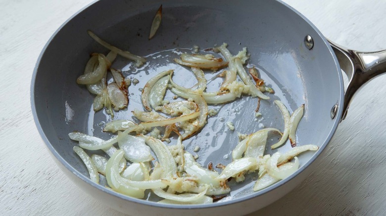 onions and garlic sauteeing in skillet