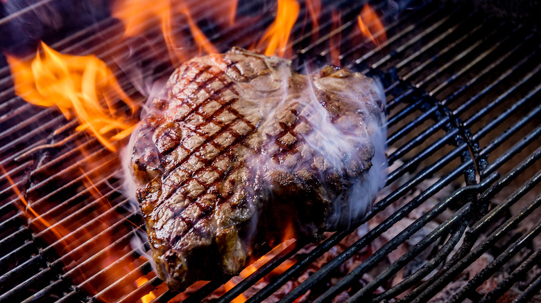 Smoky porterhouse steak on the grill