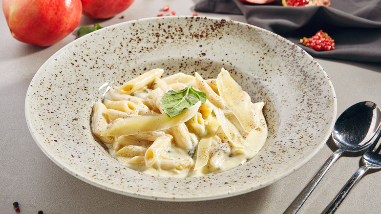 A bowl of cheesy penne pasta