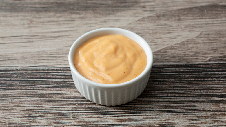 A small bowl of spicy ranch dressing