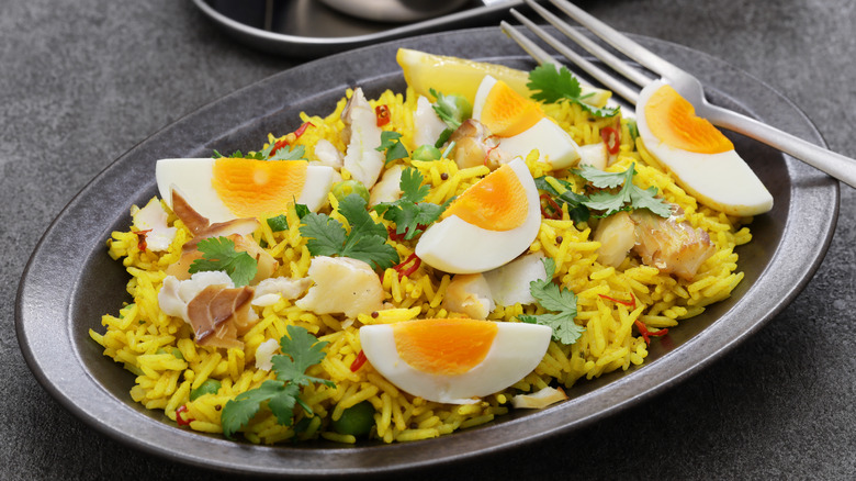 A plate of kedgeree with spiced rice and quartered eggs