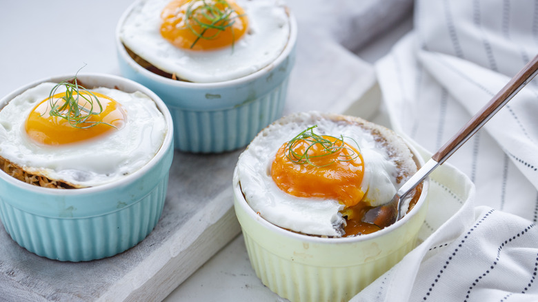 Shirred eggs in ceramic ramekins