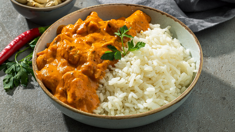 Bowl of chicken tikka masala over rice