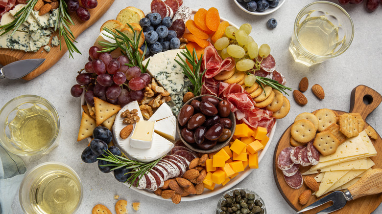 various cheeses served with meats and crackers