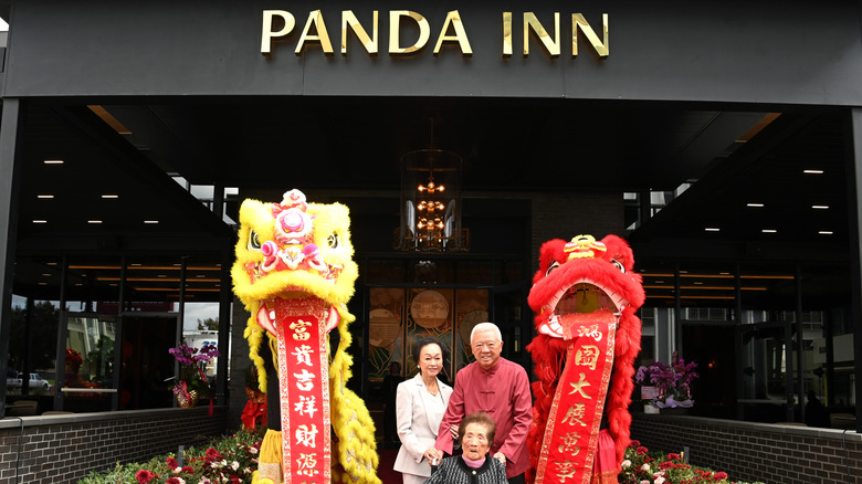 The Cherng family in front of Panda Inn storefront