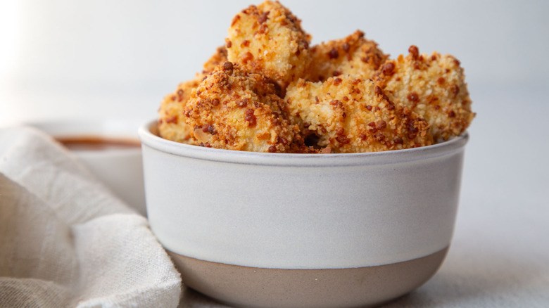 Popcorn chicken in a white bowl