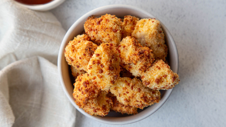 Popcorn chicken in a white bowl