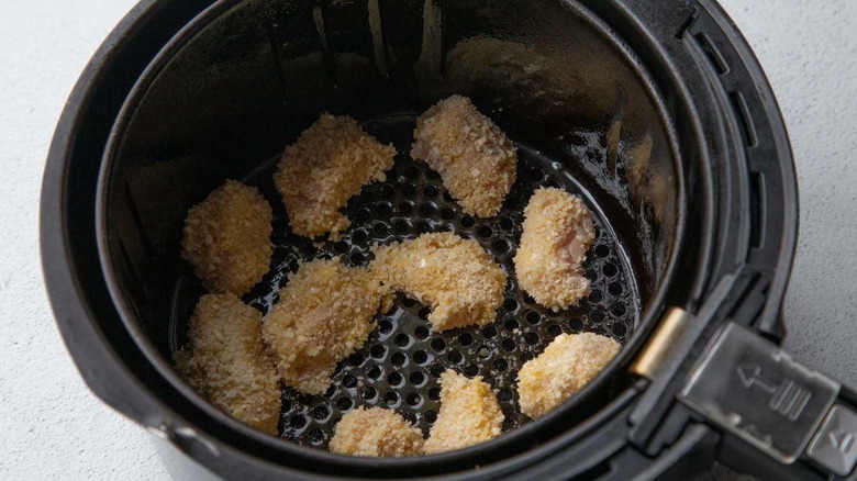 Breaded chicken chunks in an air fryer