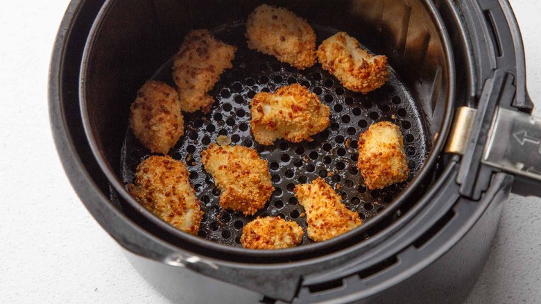Breaded chicken chunks in an air fryer