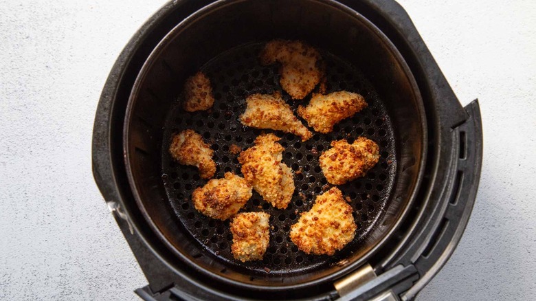 Breaded chicken chunks in an air fryer