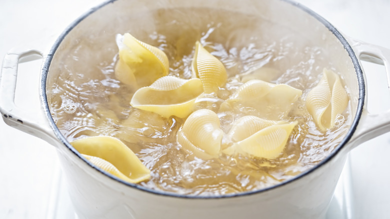 Pasta shells cooking in a pot
