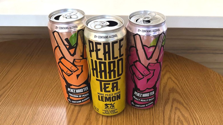 three peace hard tea cans