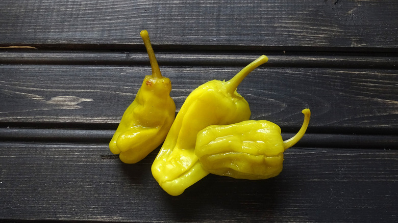 Pepperoncinis on wooden background