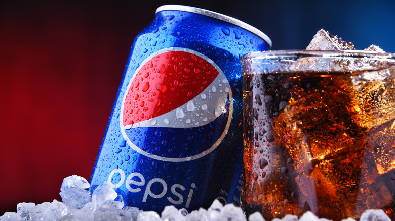 Glass and can of Pepsi