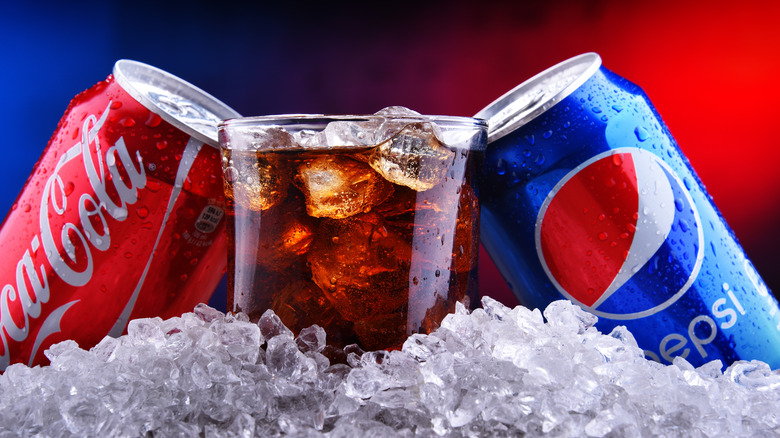 cans of Coca-Cola and Pepsi