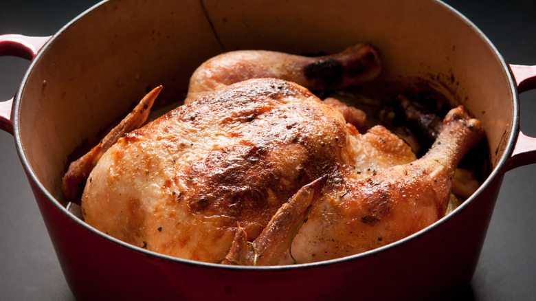 Whole roast chicken in a Dutch oven