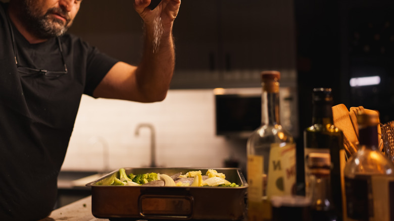 Chef salting a dish