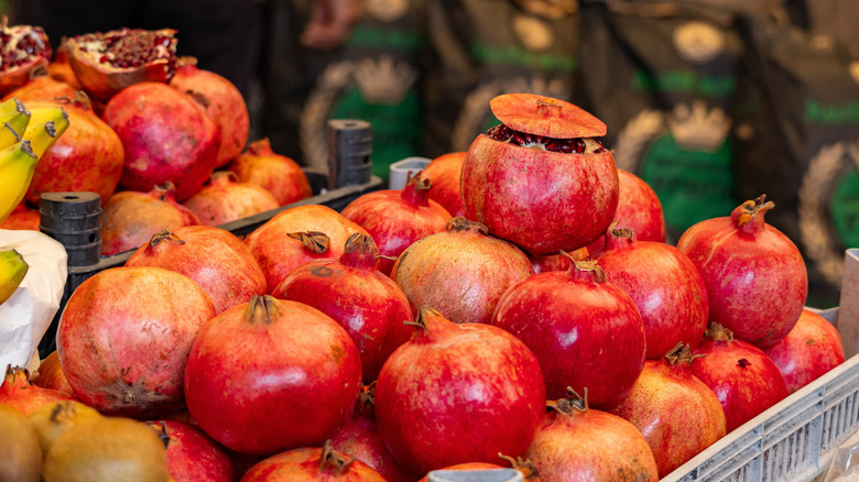 Closeup of pomegranates in a crate