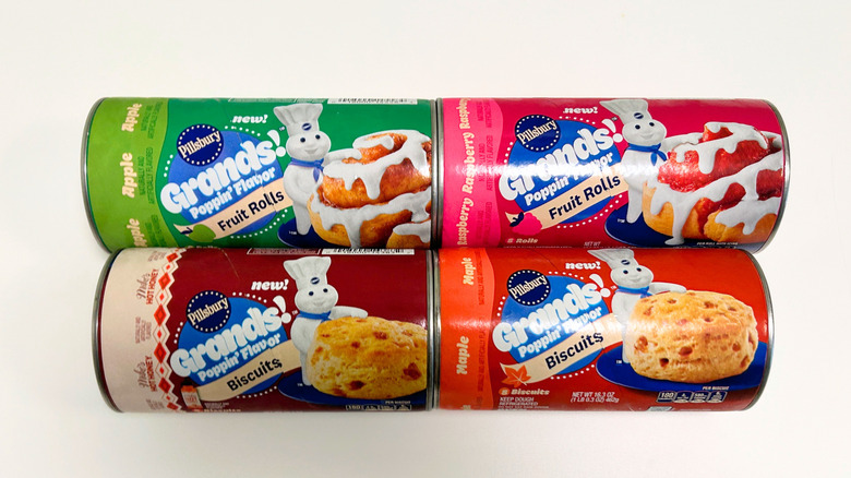 Four cans of Pillsbury's Poppin' Flavor Products