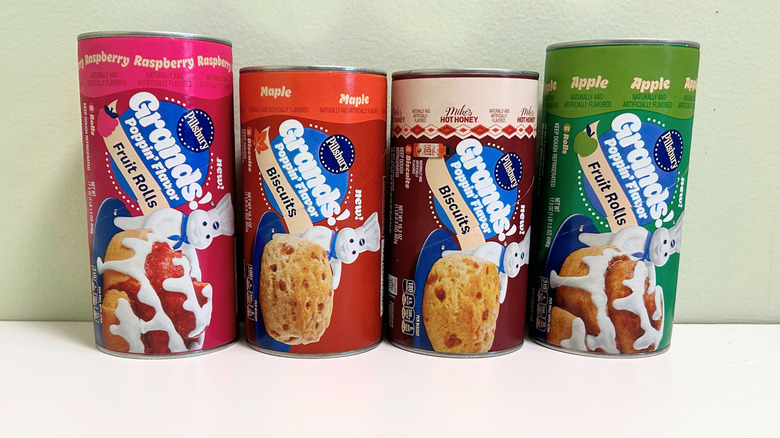 Four cans of Grands! Poppin' Flavors together in a line