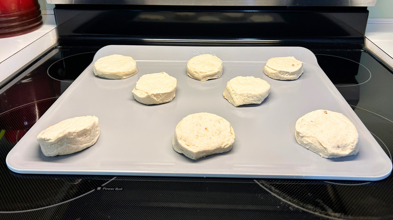 Uncooked biscuits on a pan ready to go into the oven
