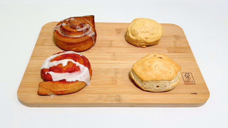All four flavors of the new Pillsbury line up arranged together on a wooden cutting board