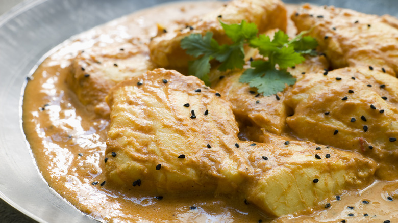 fish filets served with a creamy milk sauce