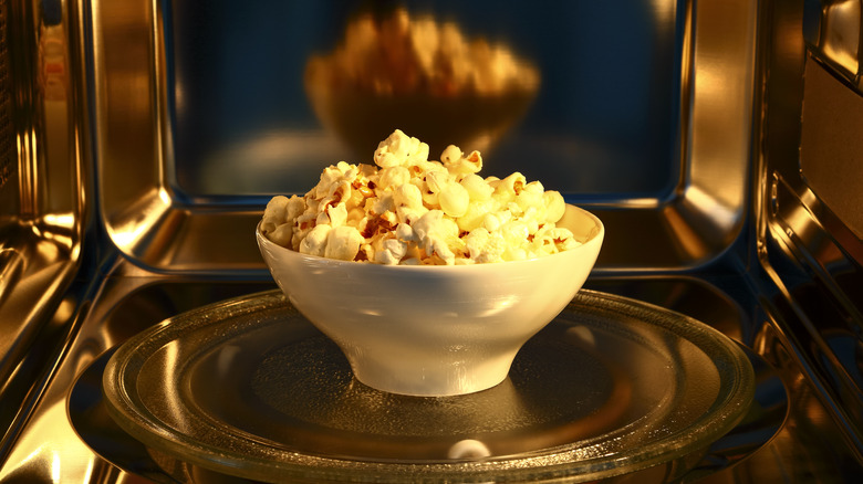 A bowl of popcorn in the microwave