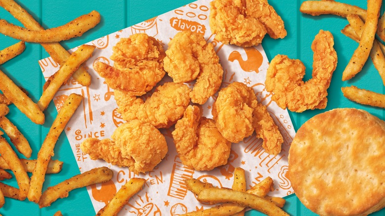 Popeyes fried shrimp and french fries and a biscuit