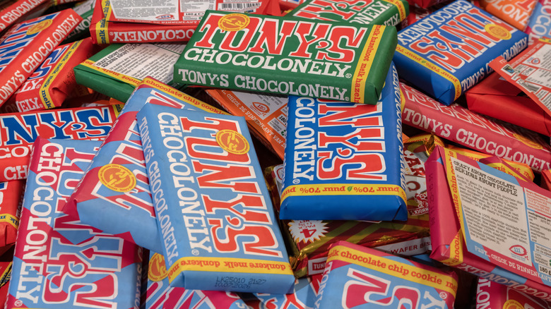 Assorted colorful bars of Tony's Chocolonely in a pile