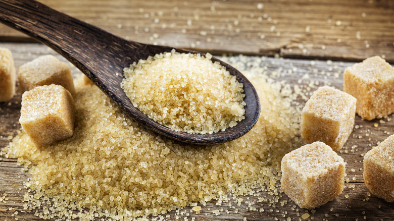 Brown sugar on wooden spoon