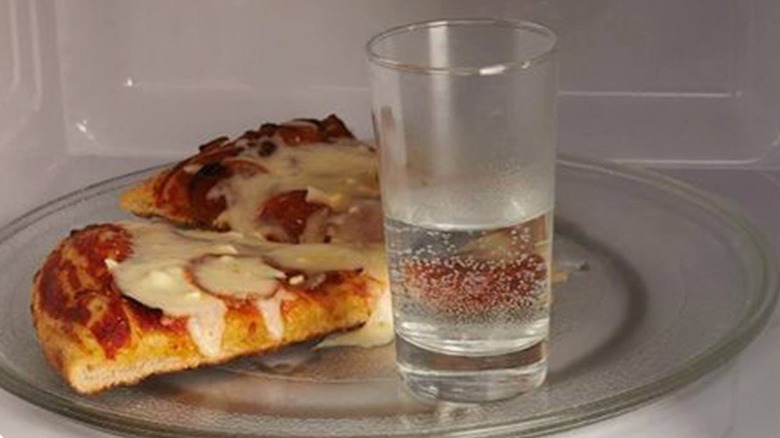 reheating pizza with glass of water
