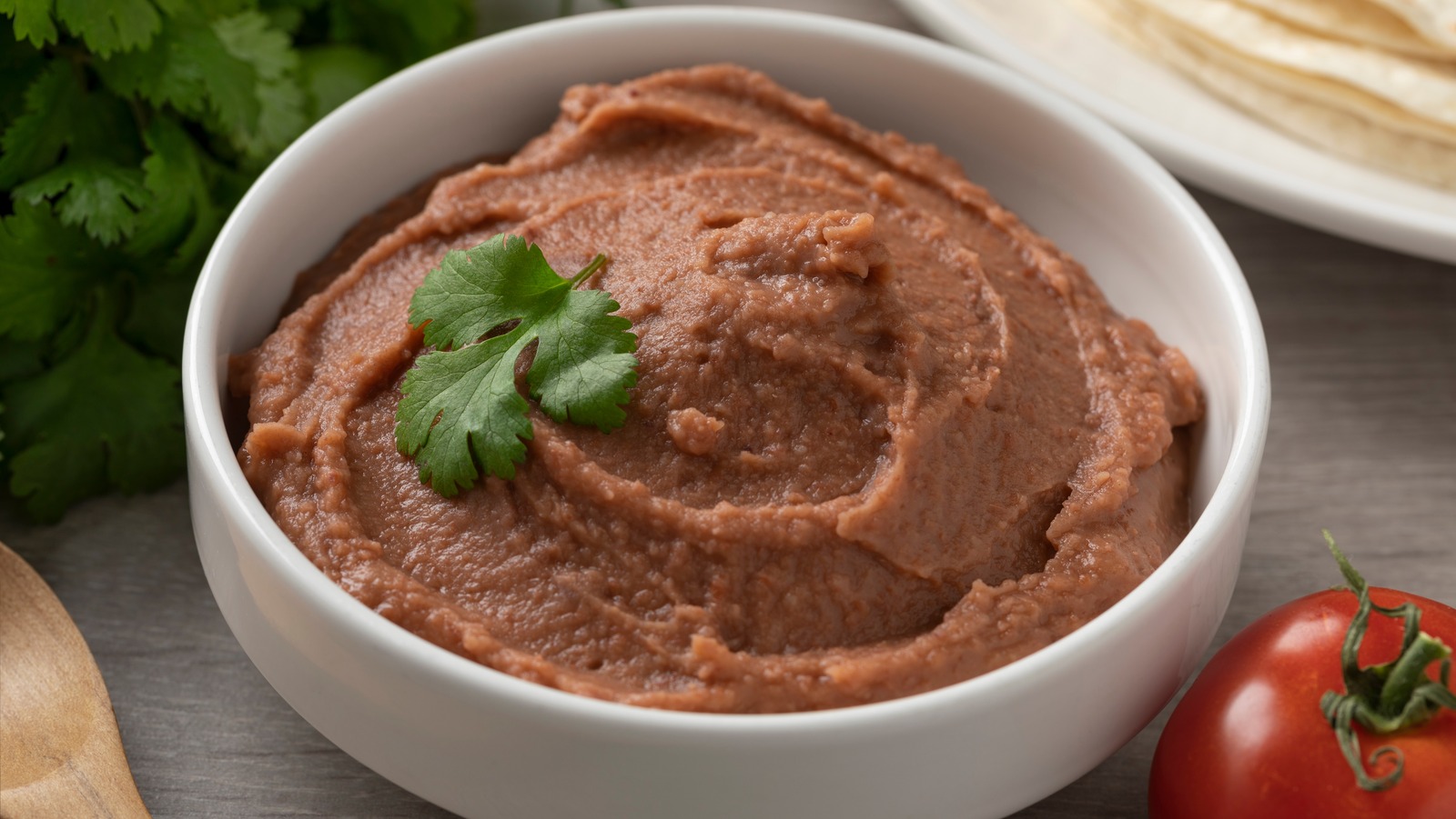 Put Leftover Bacon Fat To Use And FlavorBoost Canned Refried Beans