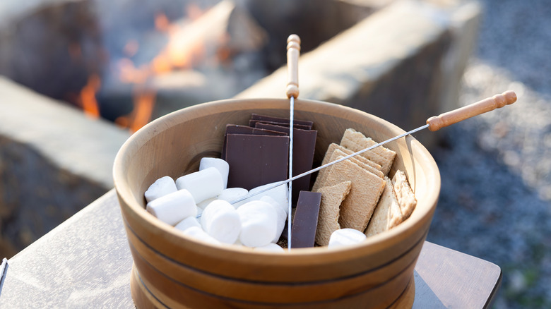 s'mores ingredients by fire pit